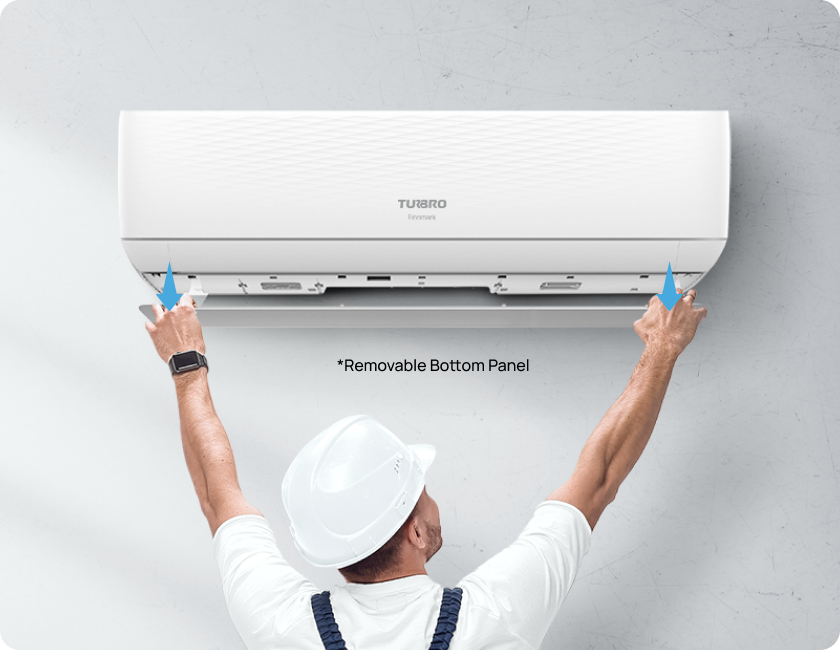 Technician installing a Turbo air conditioner with a focus on the removable bottom panel.